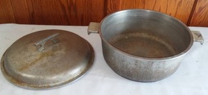 lot 15 image: 11 in. Cast Aluminum Pot and Cover.