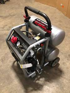 Husky 4.5 Gal. Portable Electric-Powered Silent Air Compressor   Customer Returns See Pictures