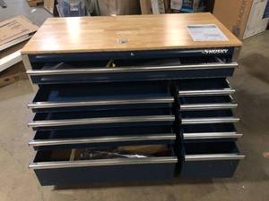 Husky 52 in. W x 24.5 in. D Standard Duty 10-Drawer Mobile Workbench Tool Chest with Solid Wood Work Top in Gloss Blue Customer Returns See Pictures