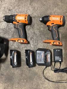 RIDGID 18V Cordless 2-Tool Combo Kit with 12 in. DrillDriver, 14 in. Impact Driver, (2) 2.0 Ah Batteries, Charger, and Bag Customer returns See Pictures