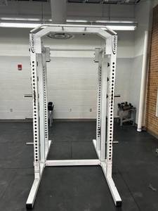 Commercial Legend double sided squat rack. J hooks and bar catches for both