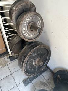 Used Olympic cast iron weight plates, weight tree included. 420lb in plates 445s 435s 425s