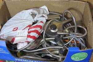Box of loose Kohler shower headsprayer kits
