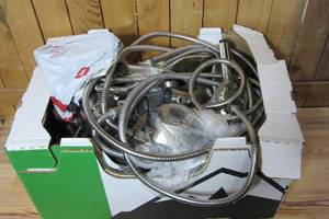 Box of loose Kohler shower headsprayer kits