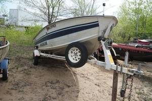 lot 7 image: Smokercraft Magnum 16 Aluminum Boat with Evinrude 70 HP Outboard and Trailer