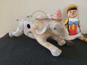 lot 70 image: Pinocchio Puppet & Dumbo Birdhouse Pair