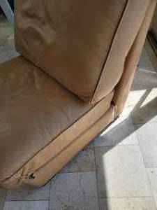 lot 33C image: Mark Suess Tan Leather Armless Chair