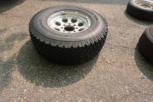 lot 23 image: 1 - BF Goodrich All Terrain TA Truck Tire On Ford 8 Bolt Rim