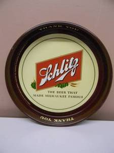 lot 28 image: VINTAGE ORIGINAL SCHLITZ BEER METAL BEER TRAY THE BEER THAT MADE MILWAUKEE FAMOUS - NICE - GREAT PIECE - APPROX 13 - SEE PICTURES