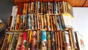 lot 9 image: Louis LAmour paperbacks.