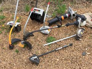 lot 14 image: Ryobi 4 Cycle With Multiple Attachments