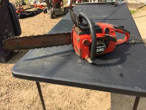 lot 146 image: Homelite 330 16 Gas Chainsaw