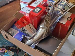 lot 264 image: Lot of  Assorted Automotive Supplies - Distributor Caps, Muffler Clamps, Pouring Spout, Auto Lights, Misc. Parts