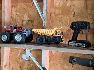 lot 370 image: Lot of (2) RC Trucks with One Electronic Sounds Controller - Caterpillar Dump Truck, Destroyer Monster Truck