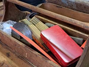 lot 451 image: 18 Wooden Tool Tote with Folding Yard Sticks, Saw Blades, Hammer, Metal Tool Case with Wrench and Sockets
