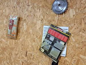 lot 459 image: Lot of (5) Misc. Items - Buffalo Gluing Clamp, Craftsman 20-pc Carbon Steel Sabre Saw Blade Variety Pack, Craftsman StapleBrad Nail Project Pack, Light