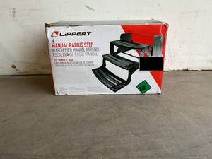 lot 37 image: Lippert Components Black 24 in. Radius Manual RV Pull Out  Triple Step with 7 in. Rise
