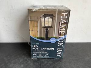 lot 126 image: Hampton Bay Solar Outdoor Hand-Painted Sanded Iron Post Lantern with Seedy Glass Shade