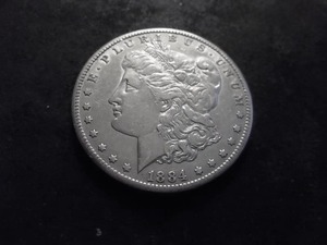 lot 15 image: 1884 CC Morgan Silver Dollar