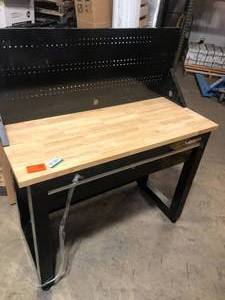 lot 40 image: Husky 4 ft. Solid Wood Top Workbench in Black with Pegboard and 1 Drawer    Customer Returns See Pictures