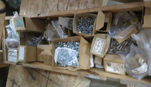 lot 87 image: WOODEN BOX FILLED WITH TONS OF UNUSED HARDWARE