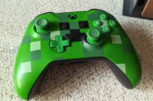 lot 45 image: Xbox One Limited Edition Minecraft Console and Four Controllers