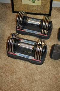 lot 943 image: Lot of (2) Reebok 5-25 lb Dumbbell Sets
