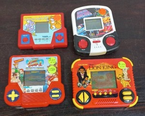 lot 60 image: Four Handheld Games