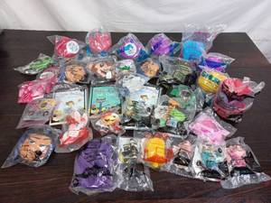 lot 61 image: Collection Of McDonalds Happy Meal Toys And Books