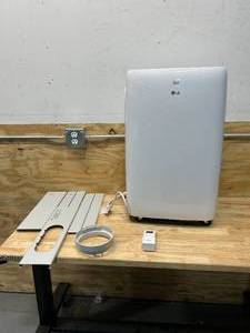 lot 74 image: LG 6,000 BTU (DOE) 115-Volt Portable Air Conditioner LP0621WSR Cools 250 Sq. Ft. with Dehumidifier Function and LCD Remote
