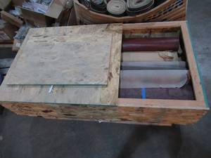 Huge plywood crate filled with leathers and other fabrics - big rolls