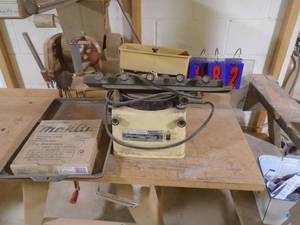 lot 182 image: Makita electric sharpener with extra wheel & clamp for plane blades. As shown.