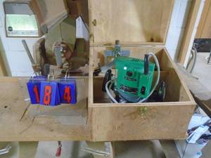 lot 184 image: Hitachi 12 router with accessories in wood box. As shown.
