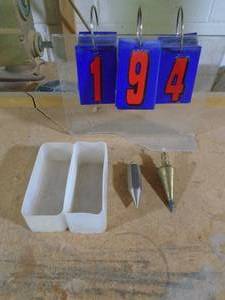 lot 194 image: Qty of 2 plump bobs brass one says general hardware no 800 made in USA. As shown.