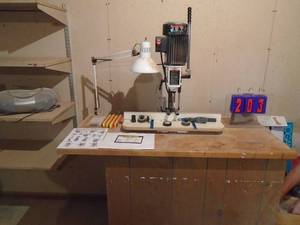 lot 203 image: Jet 110 v mortise machine with bit sharpener mounted to bench. As shown.