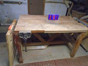 lot 281 image: Wood Work table with 4 vises & holes for bench dogs. Approx 3 x 5 with extension table. As shown.
