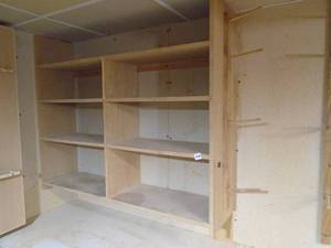 lot 299 image: Wood shelves mounted to wall. Bring tools. As shown.