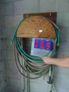 lot 355 image: Rack of garden hose. As shown.