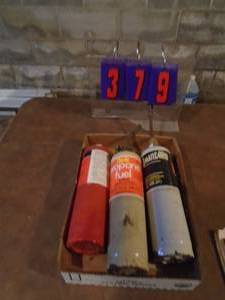 lot 379 image: Flat with 3 propane tanks, 2 torches & the striker works. As shown.
