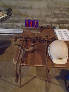 lot 387 image: Qty of 2 ladder jacks & hard hat. As shown.