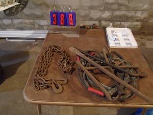 lot 388 image: Flat of jumper cableschaintire irons. As shown.