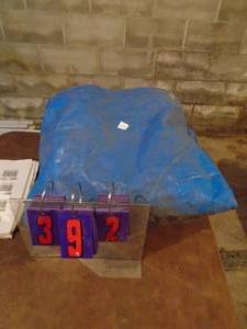 lot 392 image: Blue plastic tarp. Assume at least 10 x 10. As shown.