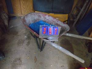 lot 397 image: Wheel barrow & tarp. As shown.