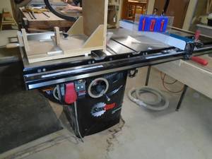 lot 101 image: Saw Stop professional 3.0 hp 220v 1ph wiener saw with extra tables router insert extra blade inserts home made sled 7 years old. As shown.