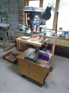 lot 120 image: Grizzly model G7943 12 speed drill press on rolling stand. As shown.
