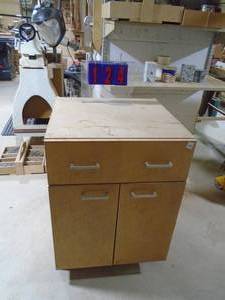 lot 124 image: Wood cabinet with hardware inside. 23 x 23 x 33. As shown.