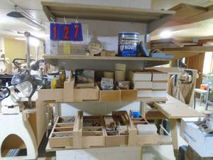 lot 127 image: Qty of 4 shelves of screwsnailsassorted hardware with shelves. 3 wide. As shown.