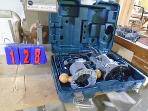 lot 128 image: Bosch model 901167087 plunge router kit in box. Looks little use. As shown.