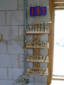 lot 151 image: Rack with 4 rows of drill bits brad pointforstneretc. As shown.