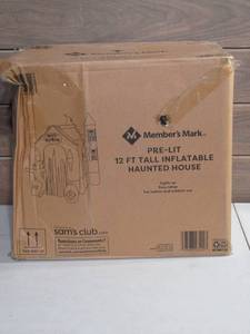 lot 28 image: Members Mark Pre-Lit 12 FT Tall Inflatable Haunted House